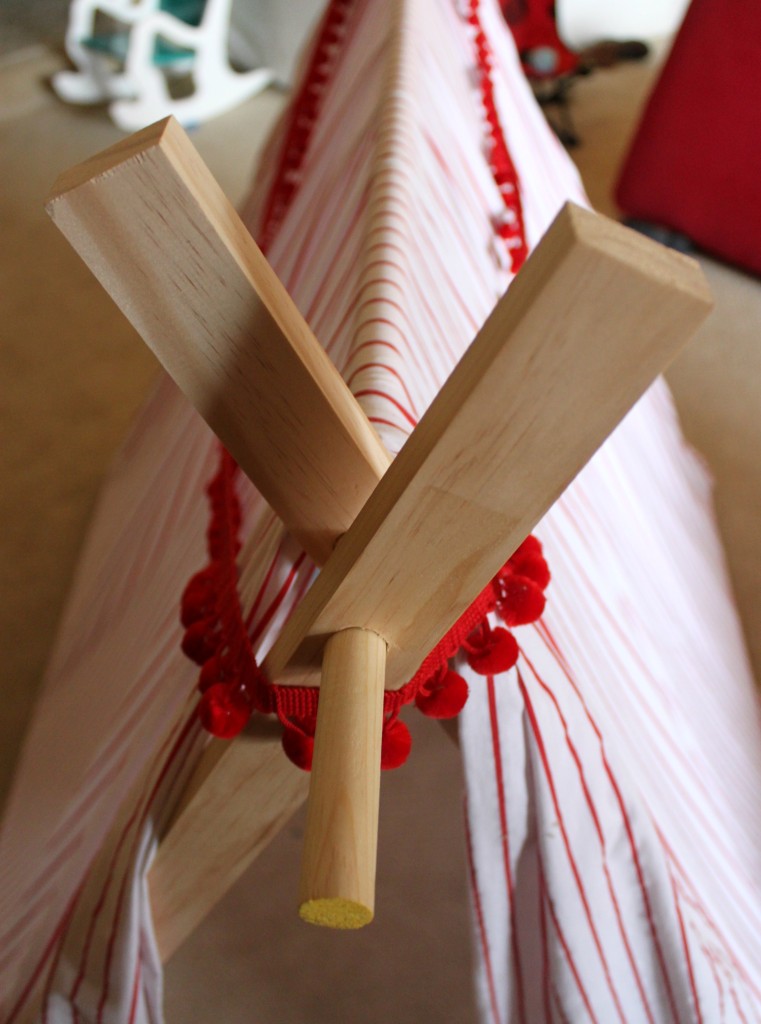 Use a dowel rod to create a DIY play tent that is easily collapsible