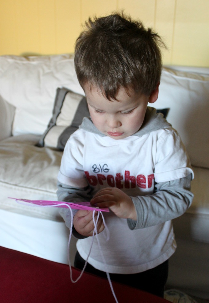 Lacing hearts with preschool kids for Valentine's Day