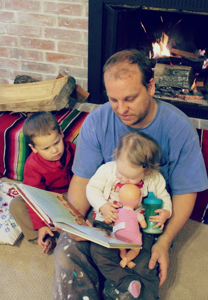 Daddy reading the Jesus Storybook Bible to kids